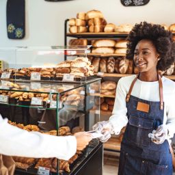 bakery owner talking with customer