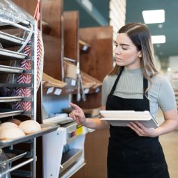 woman doing an inventory check in the bakery
