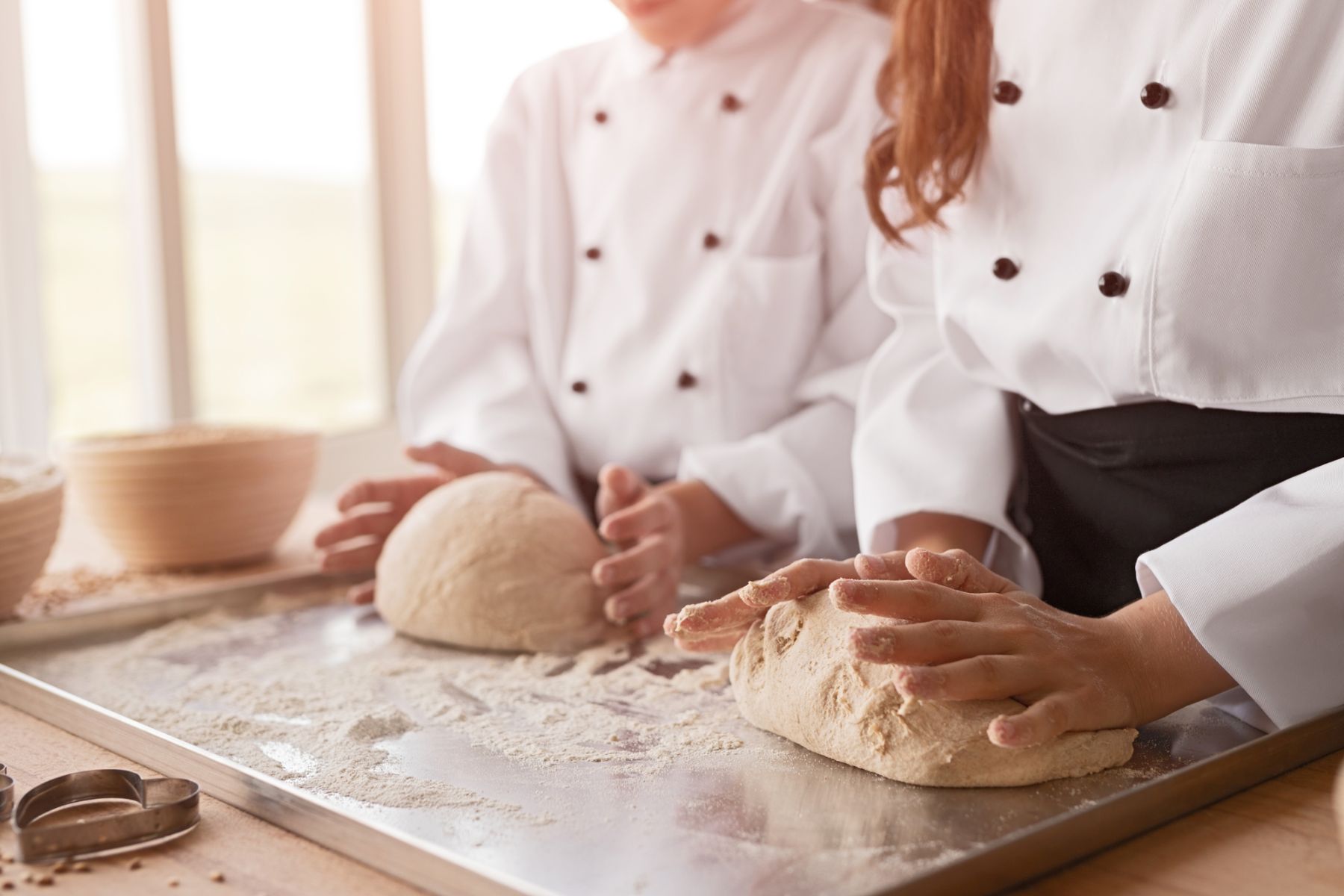 baker kneading bread